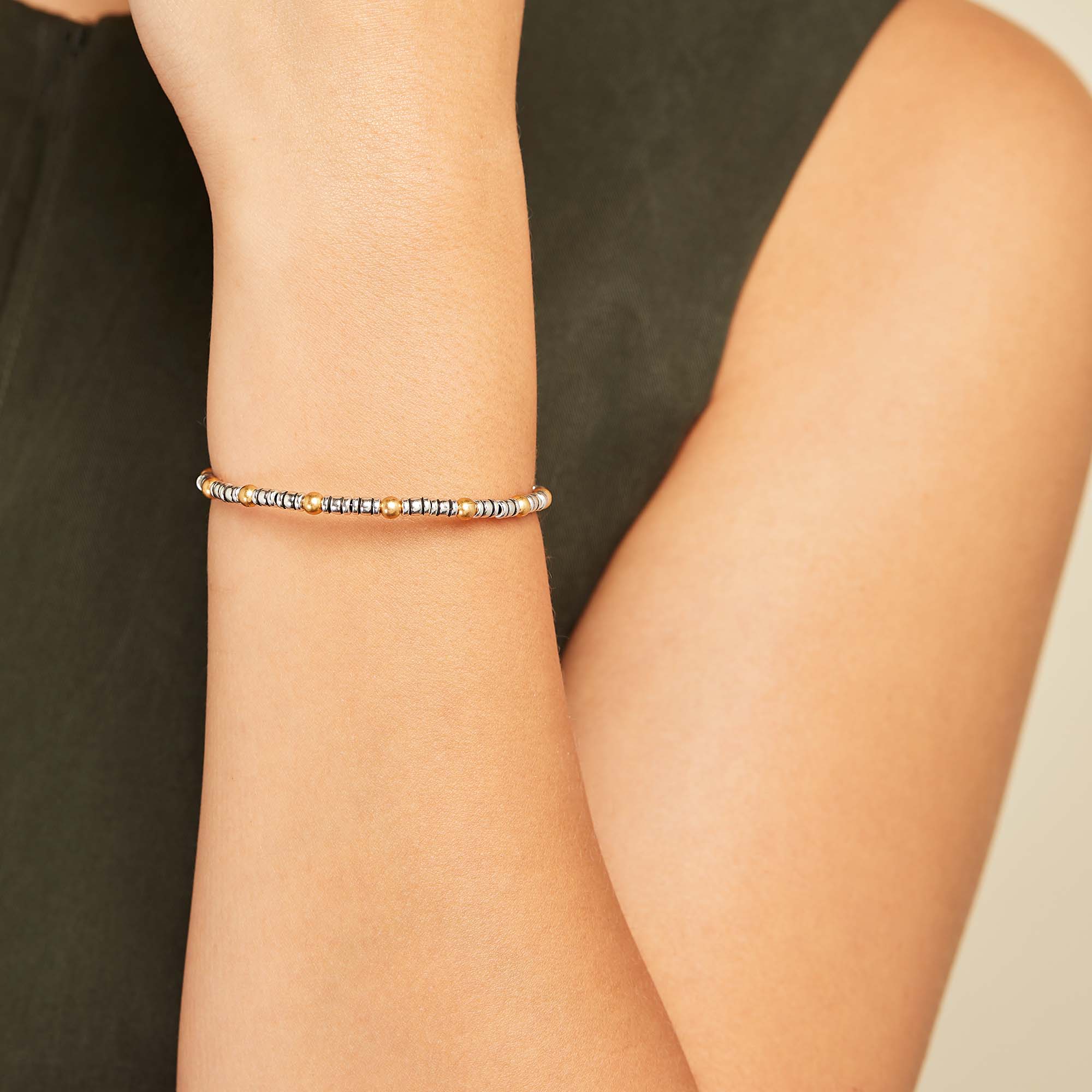 lustrous-metal-beaded-bangle-bracelet-on-model-A21EBMTLTTRSRG.jpg