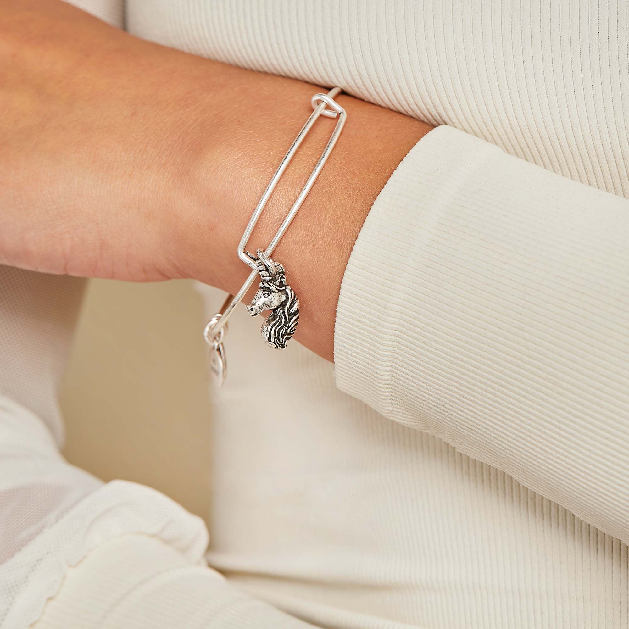 unicorn-charm-bangle-bracelet-on-model-A21EBUNCRNRS.jpg